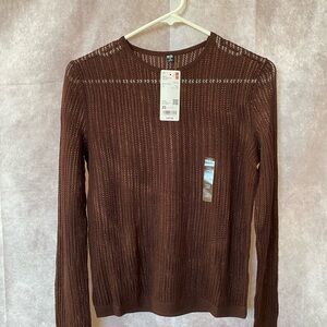 A fitted lace sweater: elegant, cozy feel — and great for layering.